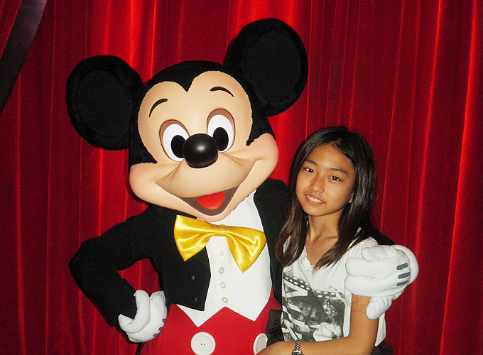 Taking a photo with Mickey Mouse. - Disneyland Paris, France.