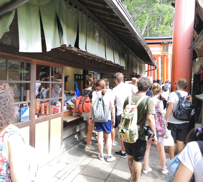 White tourists at Fushimi Inari Taisha Shrine in Kyoto.
